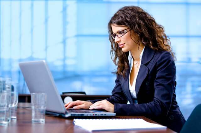 Woman works at computer